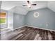 Bright bedroom with wood-look flooring, ceiling fan, and natural light at 2614 Reepsville Rd, Lincolnton, NC 28092