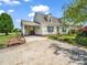 Charming home with a driveway, carport and a well-maintained lawn and beautiful landscaping at 2614 Reepsville Rd, Lincolnton, NC 28092