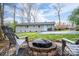 This backyard boasts a fire pit and plenty of green space, perfect for outdoor entertaining at 2617 Brookwood Rd, Lincolnton, NC 28092