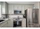 Updated kitchen boasts stainless steel appliances, granite countertops, and a stylish backsplash at 2617 Brookwood Rd, Lincolnton, NC 28092