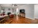 Bright living room showcasing a fireplace, hardwood floors, and ample natural light at 2617 Brookwood Rd, Lincolnton, NC 28092