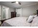 Well-lit main bedroom featuring a large bed, dresser, and a glimpse of the ensuite bathroom at 2617 Brookwood Rd, Lincolnton, NC 28092
