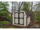Well-maintained outbuilding with barn-style doors offering versatile storage or hobby space on a landscaped lot at 2617 Brookwood Rd, Lincolnton, NC 28092