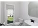 Charming powder room features a sleek vanity, modern black faucet, and natural light from the large window at 2815 Providence Spring Ln, Charlotte, NC 28270