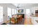 Bright dining area with hardwood floors, large windows, and adjacent access to the back porch at 2815 Providence Spring Ln, Charlotte, NC 28270
