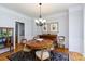 Formal dining room with a round table, hardwood floors, and traditional decor at 2815 Providence Spring Ln, Charlotte, NC 28270