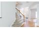 Inviting foyer with hardwood floors, staircase, and natural light creates a warm welcome to this home at 2815 Providence Spring Ln, Charlotte, NC 28270