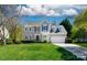 Charming two-story home with a manicured lawn and a two-car attached garage at 2815 Providence Spring Ln, Charlotte, NC 28270