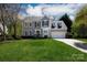 Charming two-story home with a manicured lawn and a two-car attached garage at 2815 Providence Spring Ln, Charlotte, NC 28270
