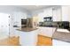 Spacious kitchen features white cabinetry, stainless appliances, and a convenient center island at 2815 Providence Spring Ln, Charlotte, NC 28270