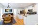 Open kitchen flows to dining area, featuring stainless appliances, and an adjacent door to the outside at 2815 Providence Spring Ln, Charlotte, NC 28270