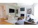 Cozy living room with fireplace, built-in bookshelves, and plenty of natural light at 2815 Providence Spring Ln, Charlotte, NC 28270