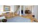 Spacious living room showcasing hardwood floors, neutral decor, and open access to the dining area at 2815 Providence Spring Ln, Charlotte, NC 28270