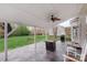 Covered patio area featuring stone flooring, outdoor fireplace, and outdoor furniture at 301 Prairie Rose Ct, Waxhaw, NC 28173
