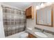 Bathroom with granite countertop vanity, neutral colored walls, and shower with curtain at 301 Prairie Rose Ct, Waxhaw, NC 28173