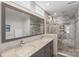 Modern bathroom features a double vanity and a large glass-enclosed shower with tile accents at 301 Prairie Rose Ct, Waxhaw, NC 28173