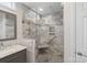 Bathroom featuring double vanity with a spacious glass shower with tile surround and built in seat at 301 Prairie Rose Ct, Waxhaw, NC 28173