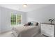 Cozy bedroom featuring a comfortable bed, dresser, and a bright window offering natural light at 301 Prairie Rose Ct, Waxhaw, NC 28173