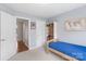Comfortable bedroom showcasing open doorway to hallway and convenient built-in shelving at 301 Prairie Rose Ct, Waxhaw, NC 28173