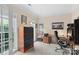 Bright office space with neutral walls, storage cabinet, ample desk space and a large window at 301 Prairie Rose Ct, Waxhaw, NC 28173