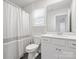Clean bathroom featuring tiled floors, a large mirror, ample counter space, and a shower with curtain at 3036 Whipcord Dr, Waxhaw, NC 28173