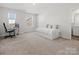 Well-lit secondary bedroom with a functional layout, offering a comfortable space for rest and productivity at 3036 Whipcord Dr, Waxhaw, NC 28173