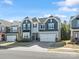 Beautiful two-story home featuring a two-car garage, a blend of siding and stone accents, and manicured landscaping at 3036 Whipcord Dr, Waxhaw, NC 28173