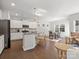 Open-concept kitchen and dining area filled with natural light at 3036 Whipcord Dr, Waxhaw, NC 28173