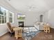 Cozy living room featuring a fireplace, plush seating, and large windows for ample light at 3036 Whipcord Dr, Waxhaw, NC 28173