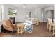 Bright living room features hardwood floors, fireplace, TV, and modern furniture at 3036 Whipcord Dr, Waxhaw, NC 28173