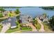 Aerial view of a luxurious waterfront property with lush landscaping and a private boat dock at 325 Ivy Arbor Cir, Rock Hill, SC 29732