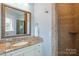 Well-appointed bathroom features a granite vanity with a mosaic tile shower surround at 325 Ivy Arbor Cir, Rock Hill, SC 29732