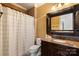 Bathroom featuring granite countertop, dark wood vanity, and shower with patterned tile at 325 Ivy Arbor Cir, Rock Hill, SC 29732