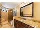 Bathroom with a vanity featuring granite countertops, tiled backsplash, and luxurious shower with glass door at 325 Ivy Arbor Cir, Rock Hill, SC 29732