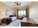 Comfortable bedroom featuring neutral walls, guitars, and a window with a scenic view at 325 Ivy Arbor Cir, Rock Hill, SC 29732