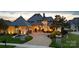 Stunning exterior view of luxurious home with stone accents, professional landscaping, and circular driveway at 325 Ivy Arbor Cir, Rock Hill, SC 29732