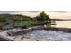 Private outdoor hot tub provides a relaxing lake view experience from a backyard space at 325 Ivy Arbor Cir, Rock Hill, SC 29732