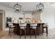 Stunning kitchen island features a dark wood base, white countertop, and stylish pendant lighting at 325 Ivy Arbor Cir, Rock Hill, SC 29732