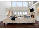 Bright and spacious living room with large windows, a fireplace, and high ceilings at 325 Ivy Arbor Cir, Rock Hill, SC 29732