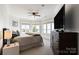 Serene bedroom showcasing a water view, neutral palette, large windows, and dark wood dresser at 325 Ivy Arbor Cir, Rock Hill, SC 29732