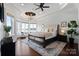 Tranquil main bedroom with tray ceiling, bay window, and views of the lake; luxurious rug and furnishings at 325 Ivy Arbor Cir, Rock Hill, SC 29732