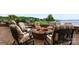 Outdoor brick firepit with comfortable cushioned chairs perfect for lakeside relaxation and entertaining with neighborhood views at 325 Ivy Arbor Cir, Rock Hill, SC 29732