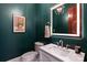 Stylish powder room features a modern vanity, backlit mirror, and custom peacock artwork at 325 Ivy Arbor Cir, Rock Hill, SC 29732