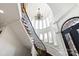Beautiful winding staircase with wrought iron railing, a chandelier and clerestory windows at 325 Ivy Arbor Cir, Rock Hill, SC 29732