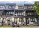 Townhome rear exterior with multiple balconies and stylish facade at 3526 Saker Ln, Charlotte, NC 28211