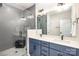 Modern bathroom featuring a glass-enclosed shower, double vanity with sleek fixtures, and stylish tile work at 3526 Saker Ln, Charlotte, NC 28211