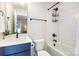 Modern bathroom with a combination shower/tub, stylish fixtures, and ample lighting at 3526 Saker Ln, Charlotte, NC 28211