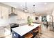 Open-concept kitchen features a large island, pendant lighting, and modern appliances, ideal for entertaining at 3526 Saker Ln, Charlotte, NC 28211