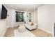 Living room features large windows, comfortable seating, and contemporary decor at 3526 Saker Ln, Charlotte, NC 28211
