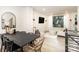 Open-concept living area with a dining table, large windows, and modern decor at 3526 Saker Ln, Charlotte, NC 28211